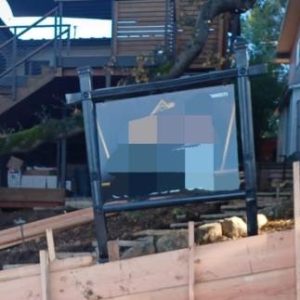 Black Commercial sign that holds a sign 38 inches tall by 52 inches wide.